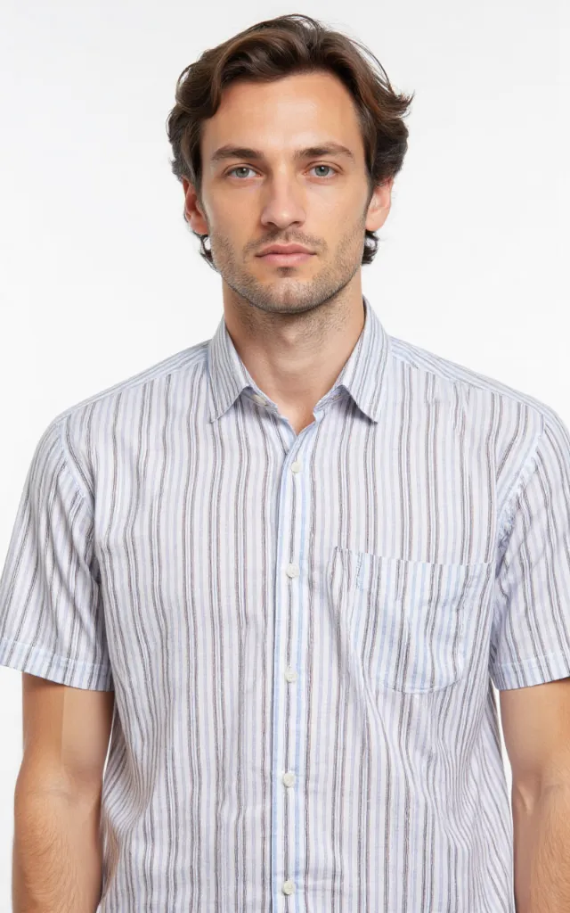 A French model wearing a Striped pattern   printed shirt, against a white background, in a front   facing bust portrait